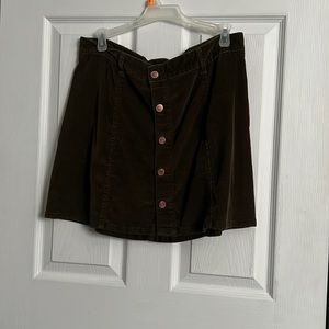 Green button mini skirt